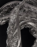 Close-up of the knitted stainless steel texture of the Genesis Floating Sculpture by Terzani.