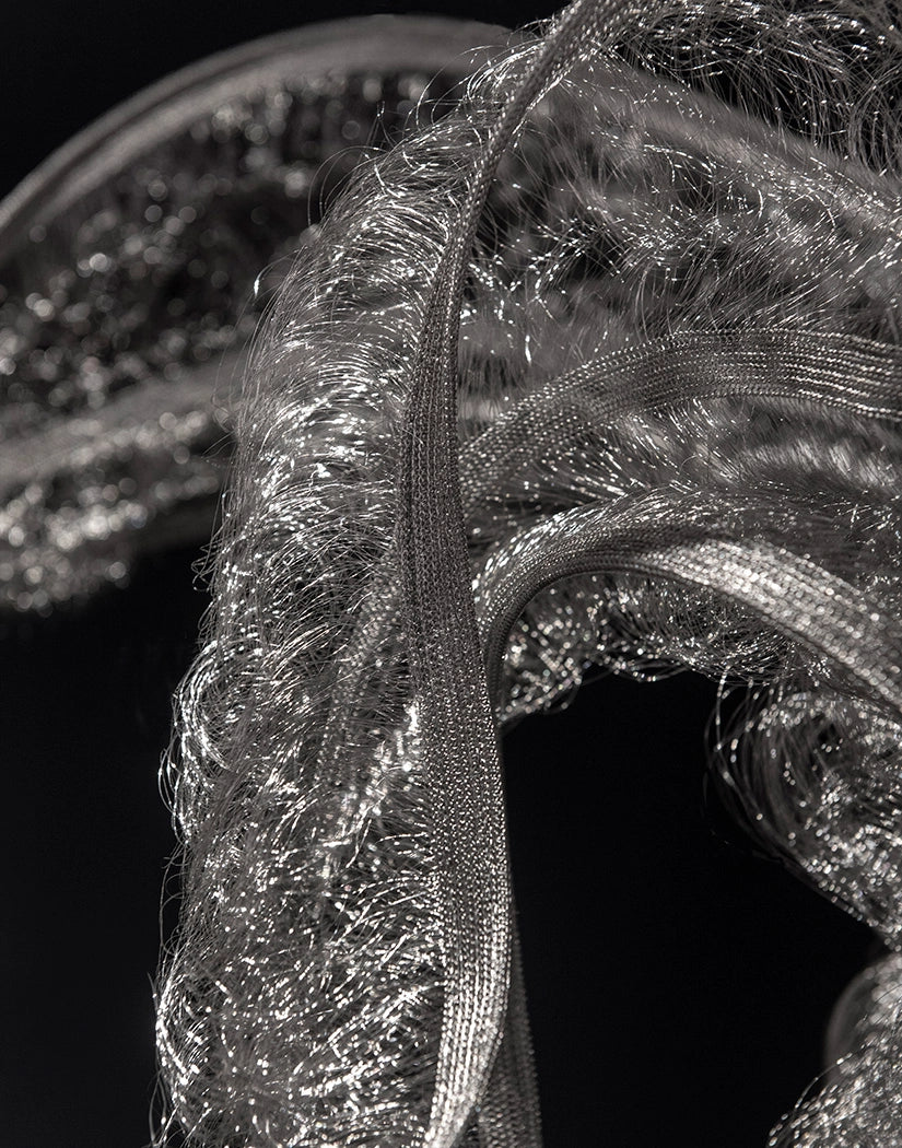 Close-up of the knitted stainless steel texture of the Genesis Floating Sculpture by Terzani.
