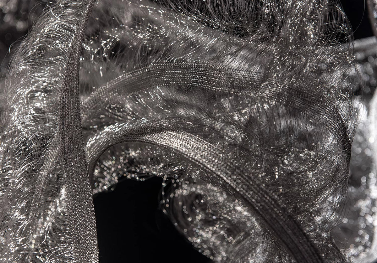 Detail of the stainless steel weave and structured edge of the Genesis Floating Sculpture by Terzani.