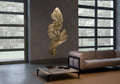 Genesis Vertical Floating Knit Sculpture by Terzani in brass, suspended in a contemporary living room.